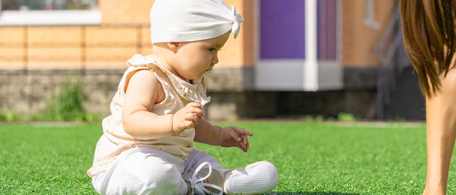 baby on fake grass auckland